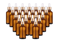 精油のパーソナル ケアの使用のための金帽子の空のガラス ビン