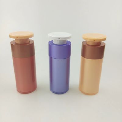 白いプッシュダウンプレスポンプの紫色プラスチック化粧品配給器ボトル